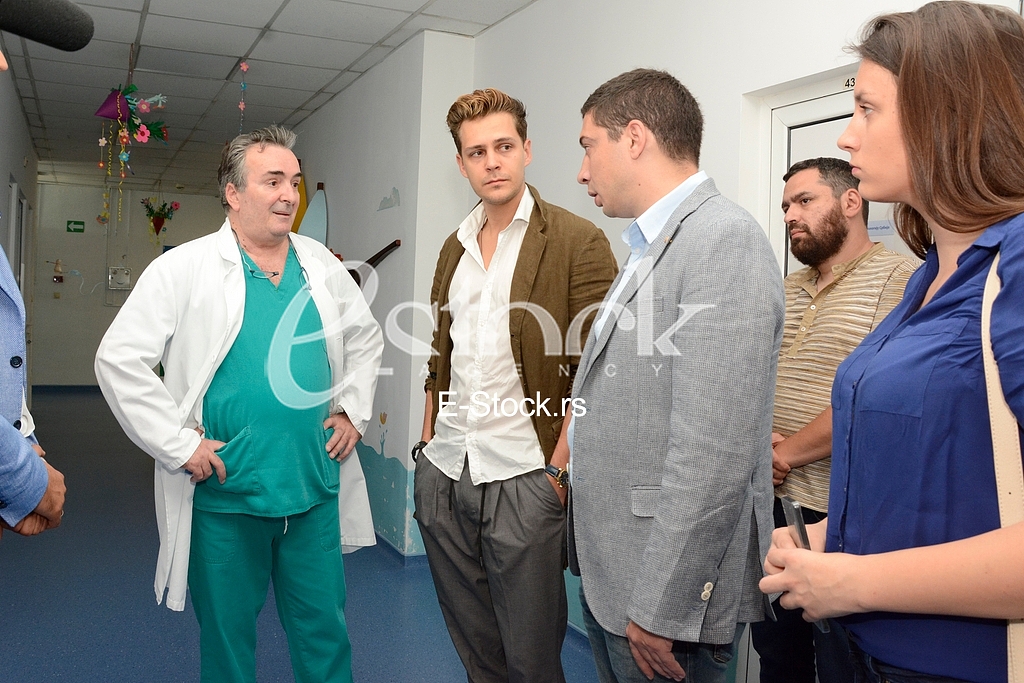 actor Milos Bikovic spending time with children at the Department of Oncology