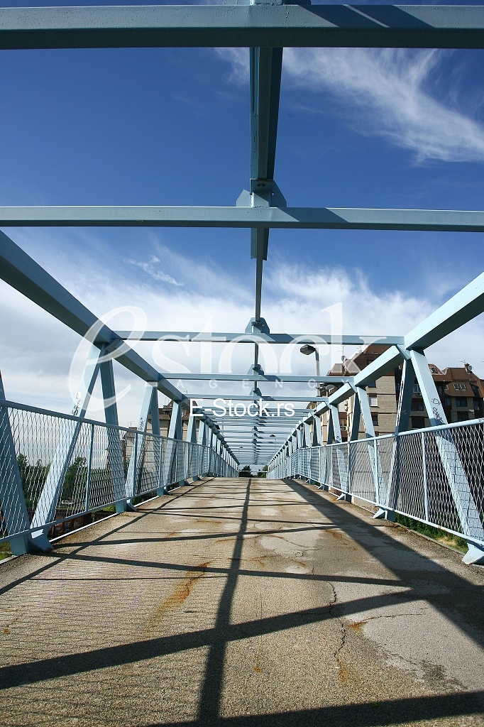 a metal bridge in blue, gangway pedestrian footbridges