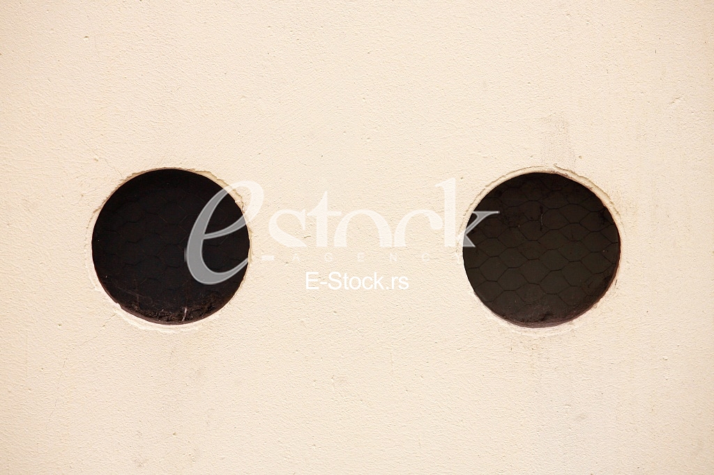 yellow wall with black holes yellow wall with black holes