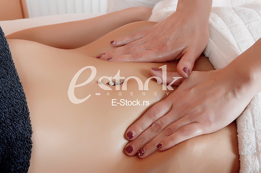 Young woman massage in spa salon