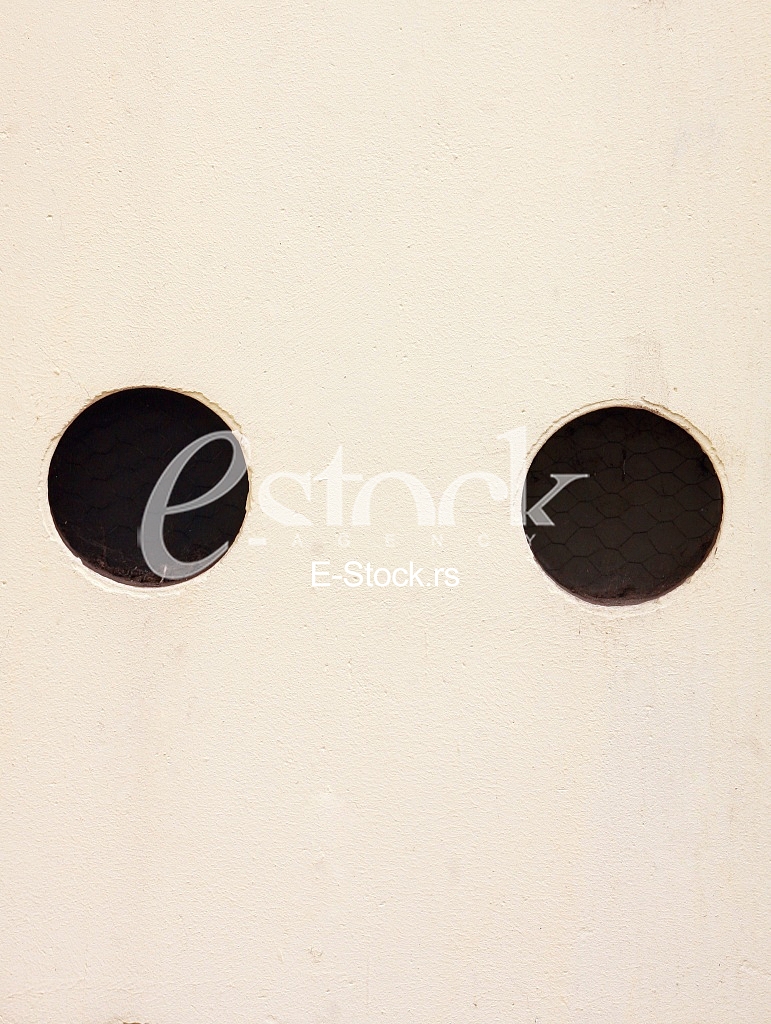 yellow wall with black holes yellow wall with black holes