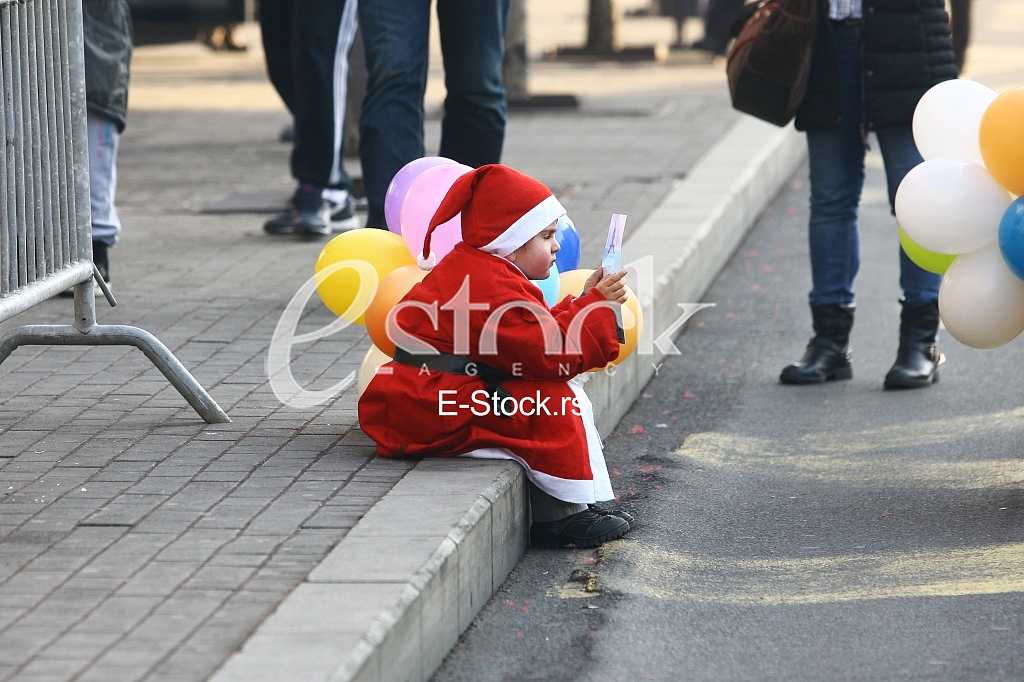 People in Santa Claus costumes take part in the race