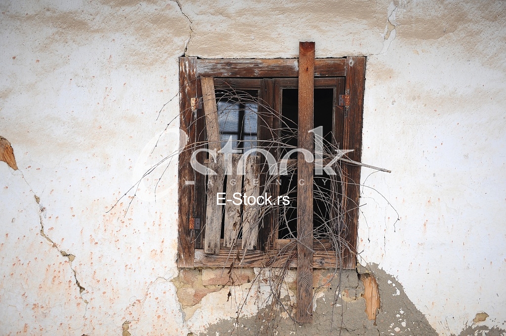 old dirty window on dirty wall