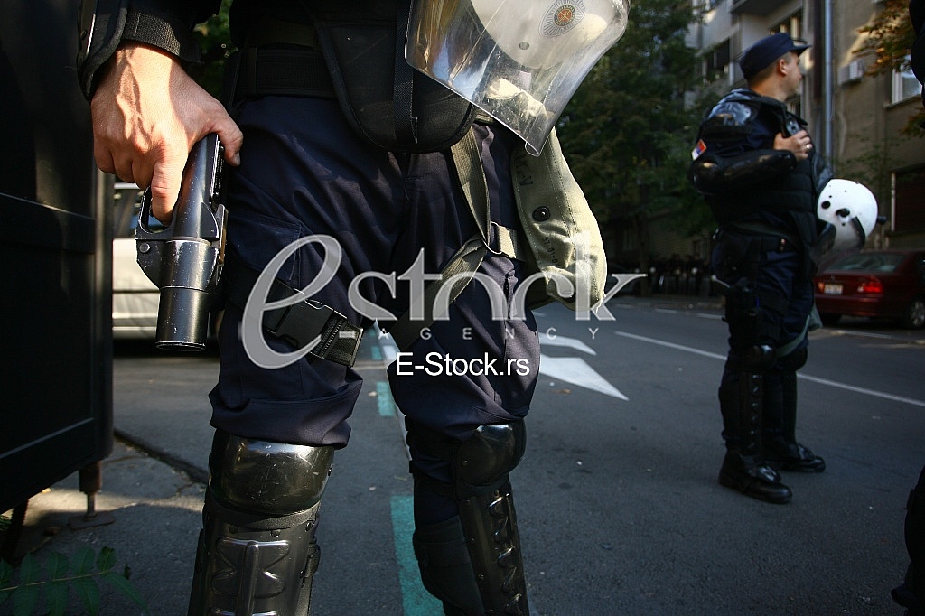 Police officer is holding with a rifle