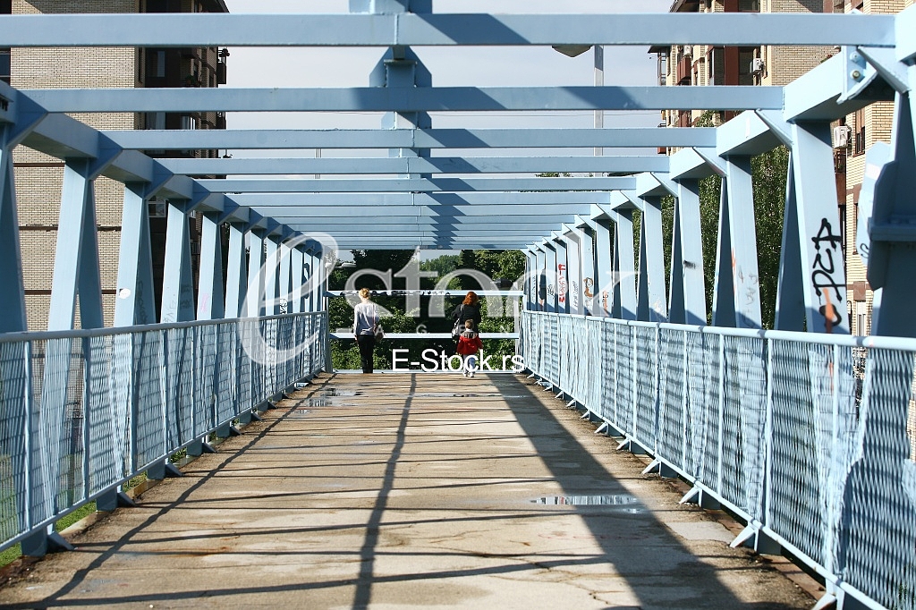 a metal bridge in blue, gangway pedestrian footbridges