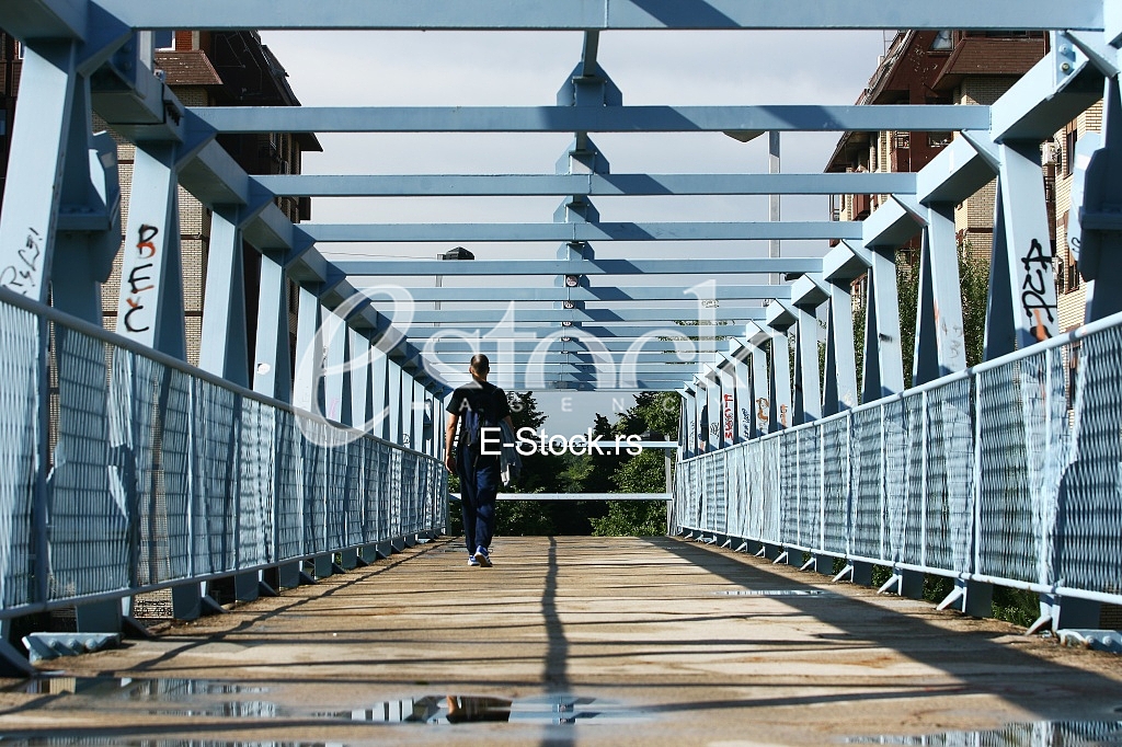 a metal bridge in blue, gangway pedestrian footbridges