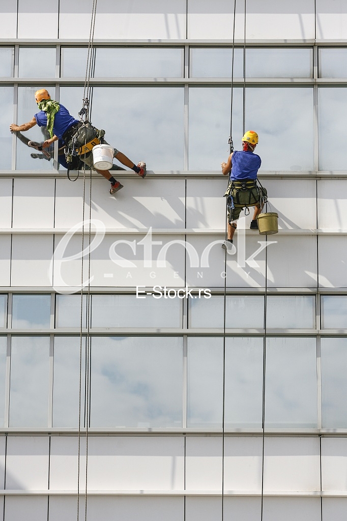 window cleaners on a building