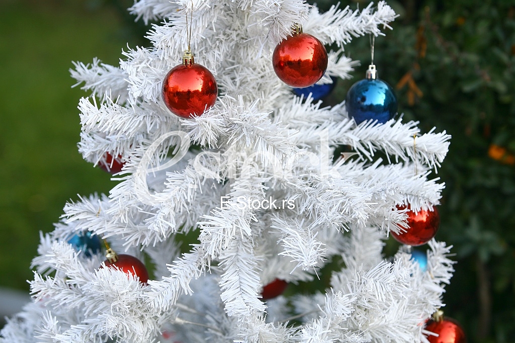 White Christmas tree with colorful ornaments White Christmas tree with colorful ornaments