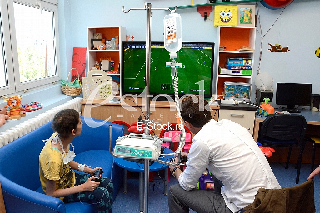 actor Milos Bikovic spending time with children at the Department of Oncology