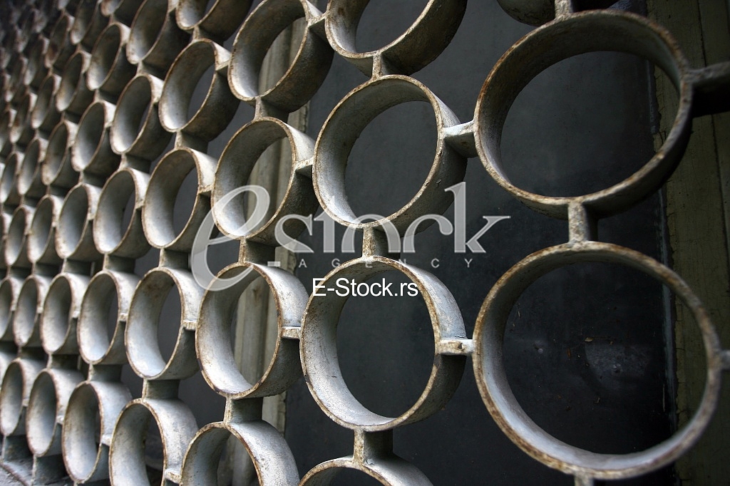decorative iron window pattern, metal protection on the window, Metal net circle texture background networks with holes decorative iron window pattern, metal protection on the window, Metal net circle texture background networks with holes