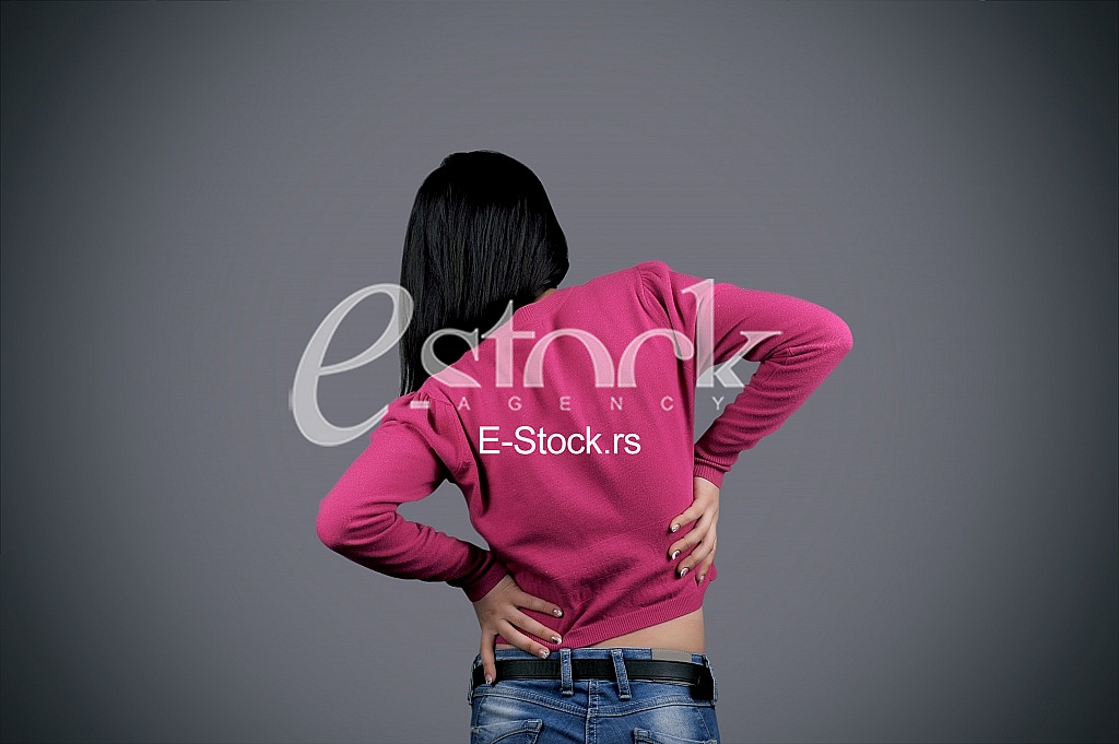 Woman holding back in pain Woman holding back in pain