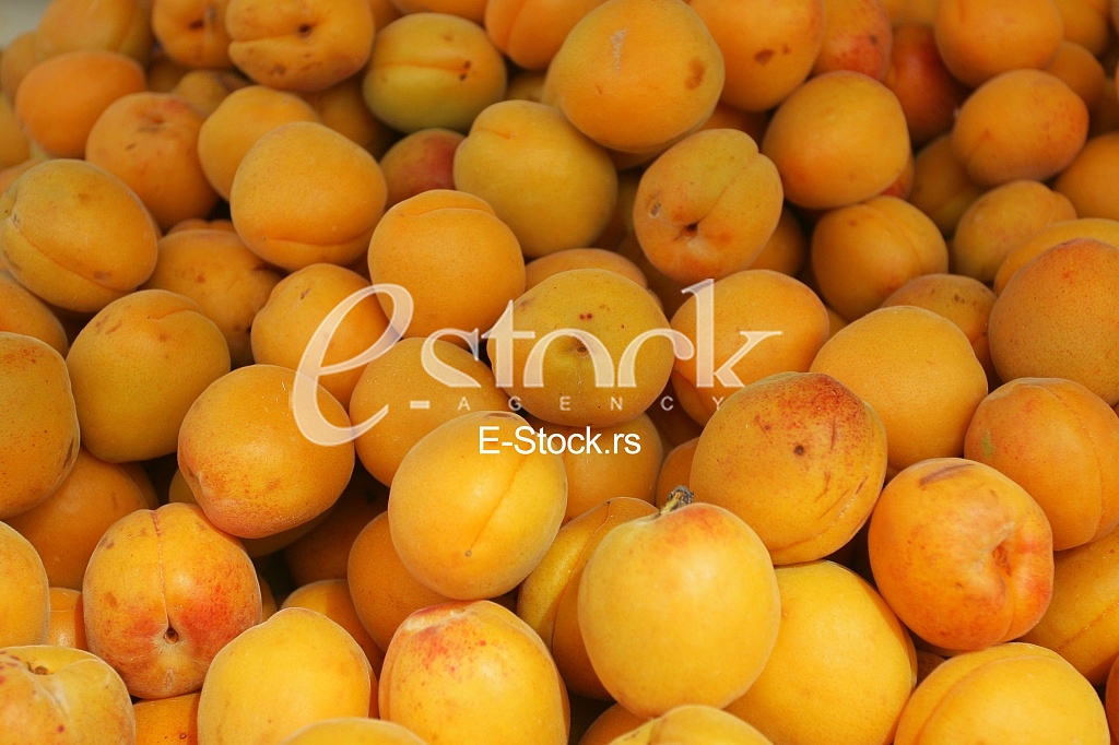 Fresh natural apricot to background on the street market