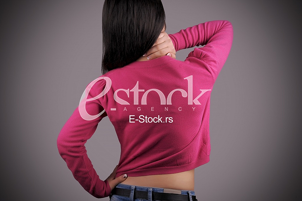 Woman holding back in pain Woman holding back in pain