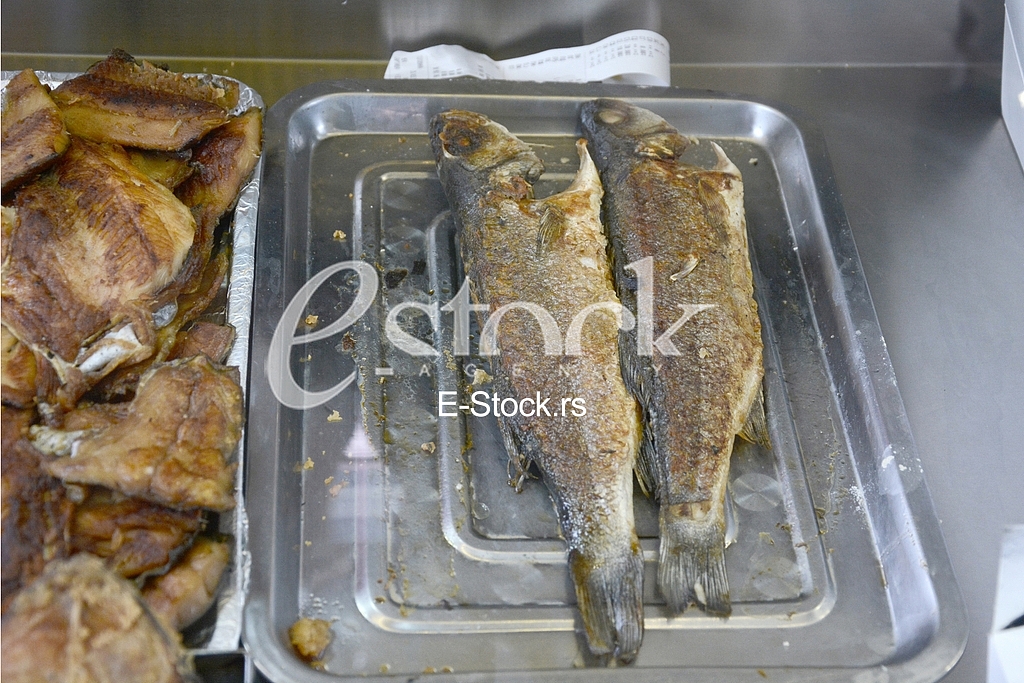 Preparing fish for eating.