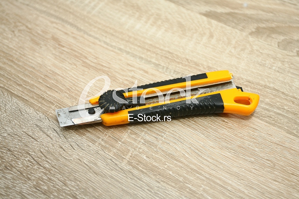 A box cutter isolated against a table background