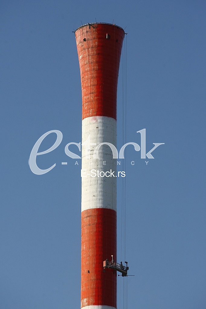 Heat and power central, smoke pipe against clear blue sky Heat and power central, smoke pipe against clear blue sky