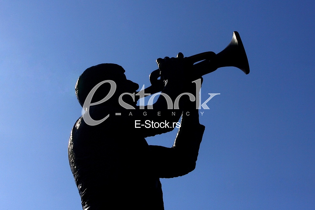 silhouette of the monument in Guca trumpet