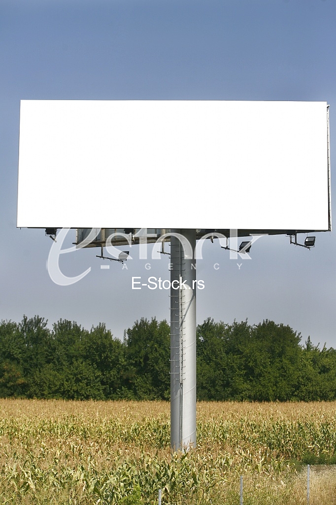 Empty billboard on background of sunset sky