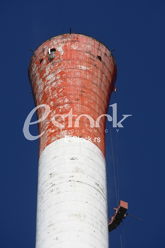 Heat and power central, smoke pipe against clear blue sky