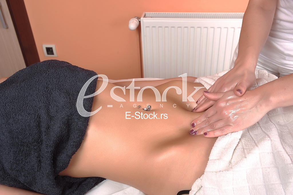 Young woman massage in spa salon