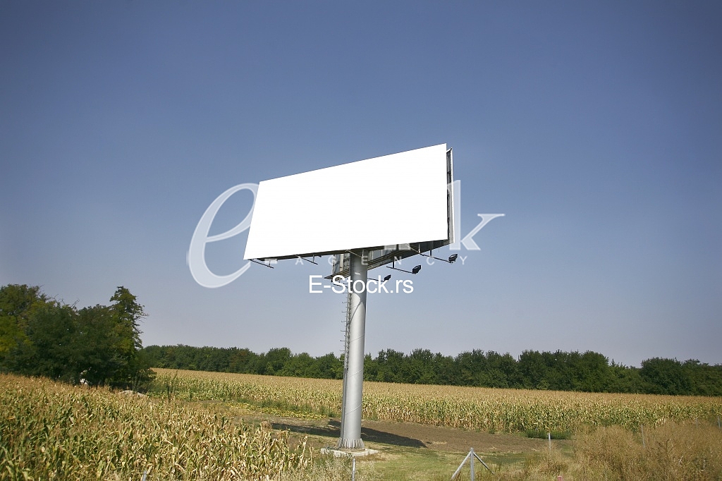 Empty billboard on background of sunset sky