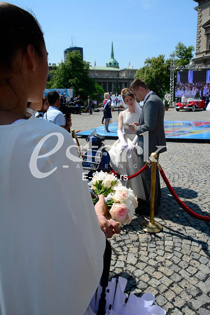 group wedding in front of City Assembly