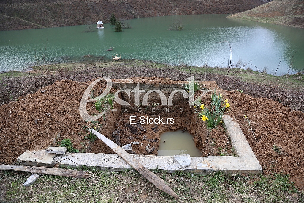 Unearthed grave near flooding Monastery Valjevska Gracanica in lake