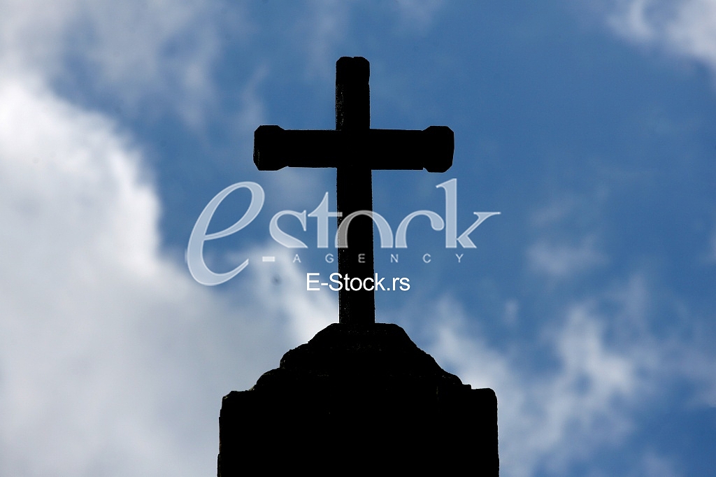 stone Cross silhouette and the holy blue sky