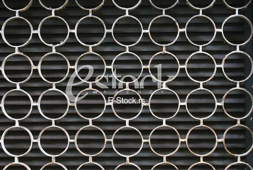 decorative iron window pattern, metal protection on the window, Metal net circle texture background networks with holes