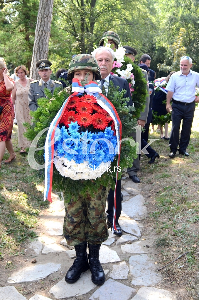 Laying a wreath at the monument to Archibald Reiss