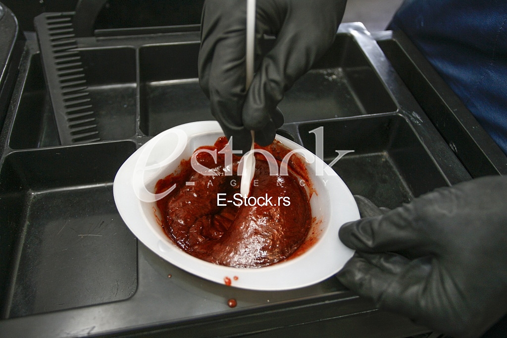 Hairdresser preparing peroxide for hair dyeing treatment