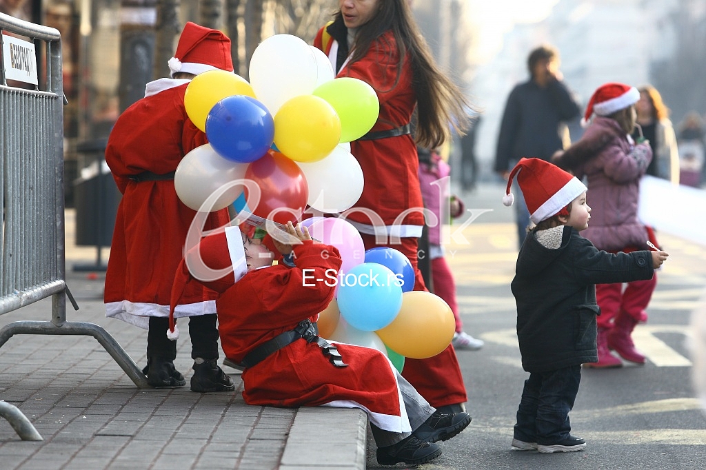 People in Santa Claus costumes take part in the race
