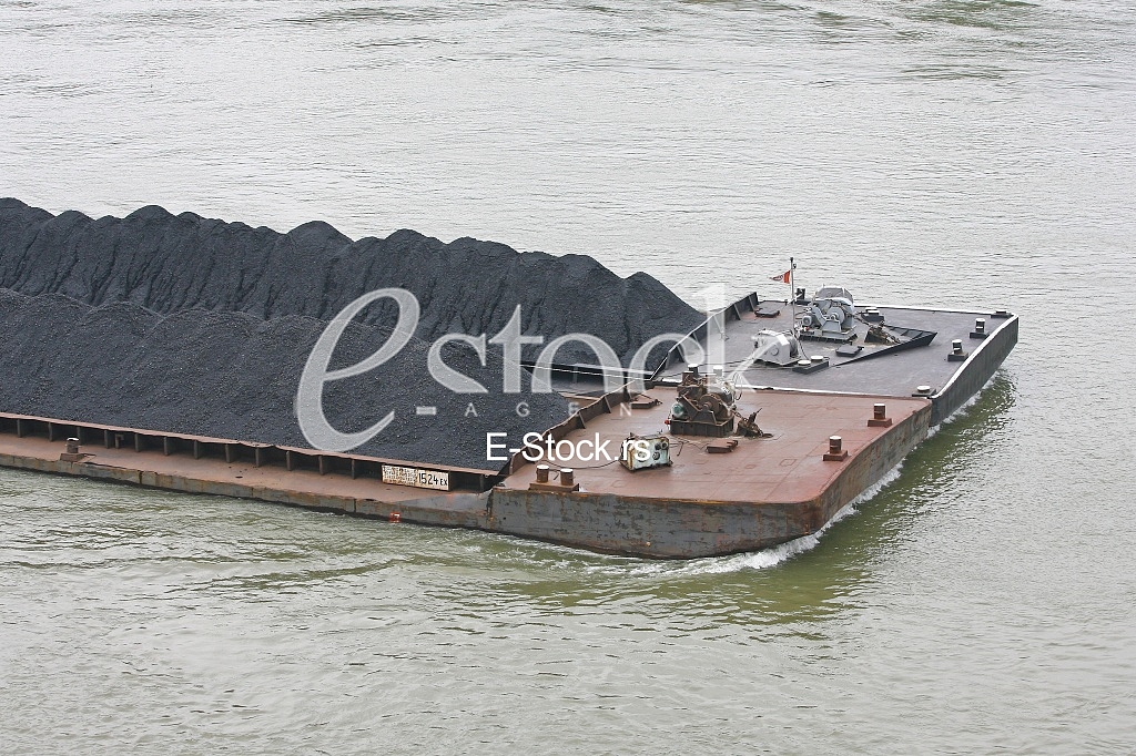 push boat Barge pushed by towboat on the river freighter ship with the coal