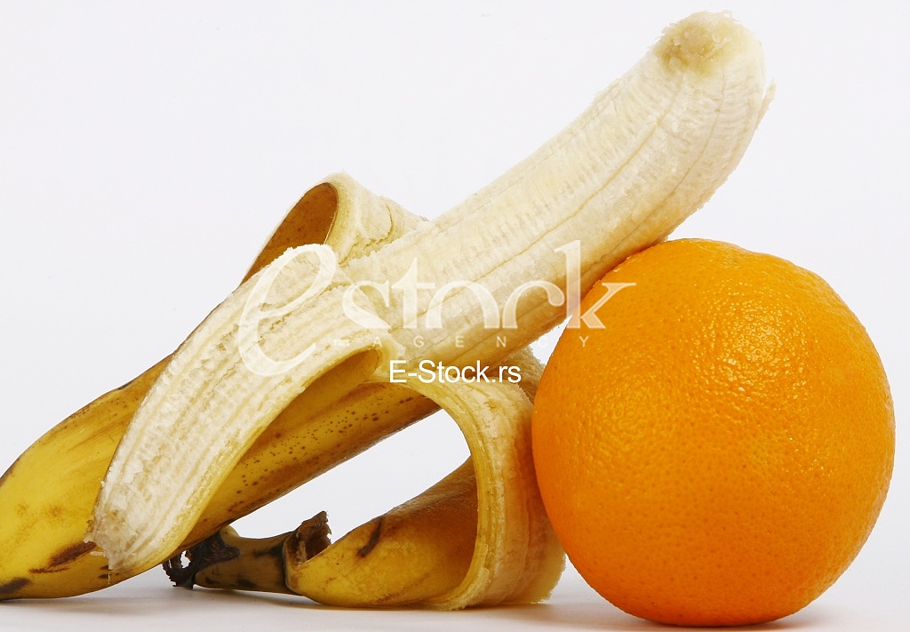 Fresh ripe bananas bunch and orange isolated on white background