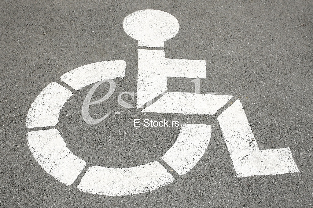 parking sign for handicapped painted on the street