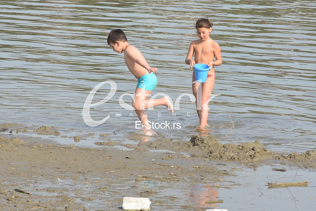 Childern on the beach strand enjoy the Spring sunny day