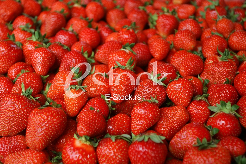 Strawberry fresh natural juicy strawberries to background on the street market
