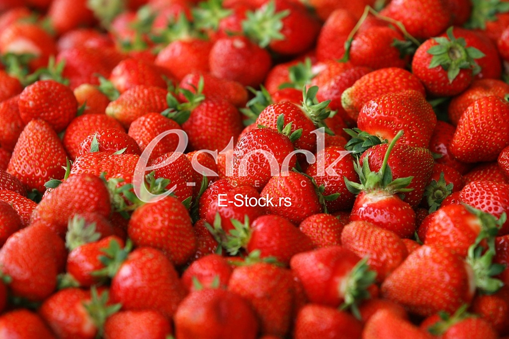Strawberry fresh natural juicy strawberries to background on the street market
