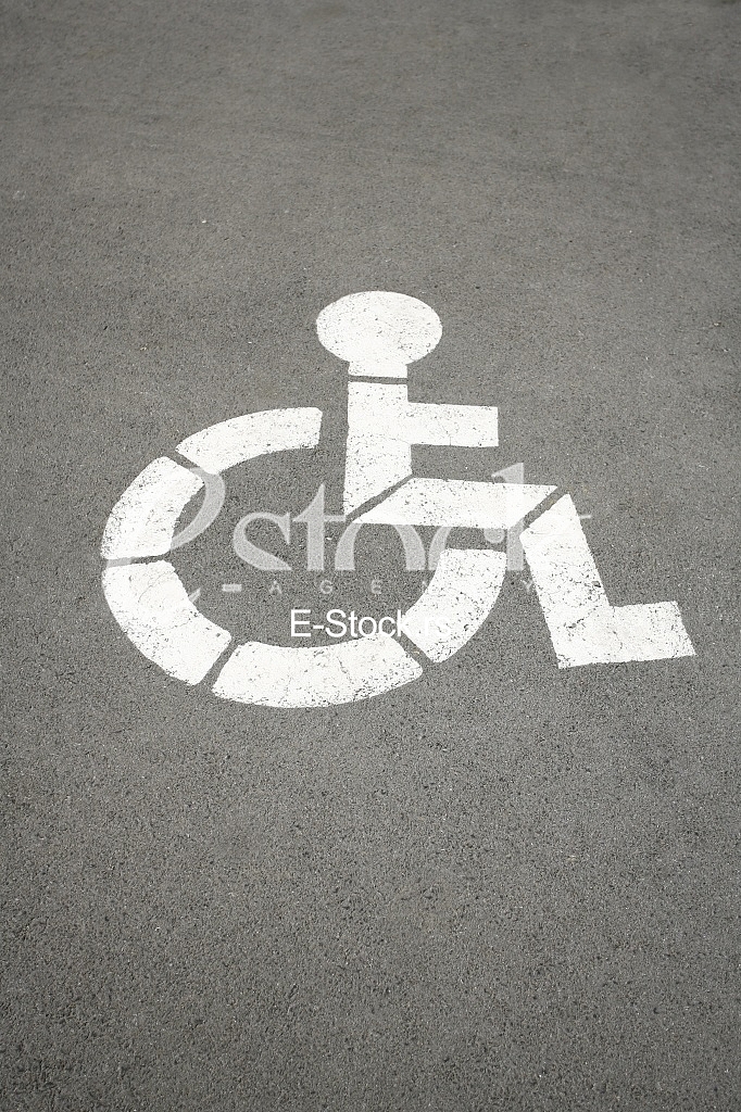 parking sign for handicapped painted on the street