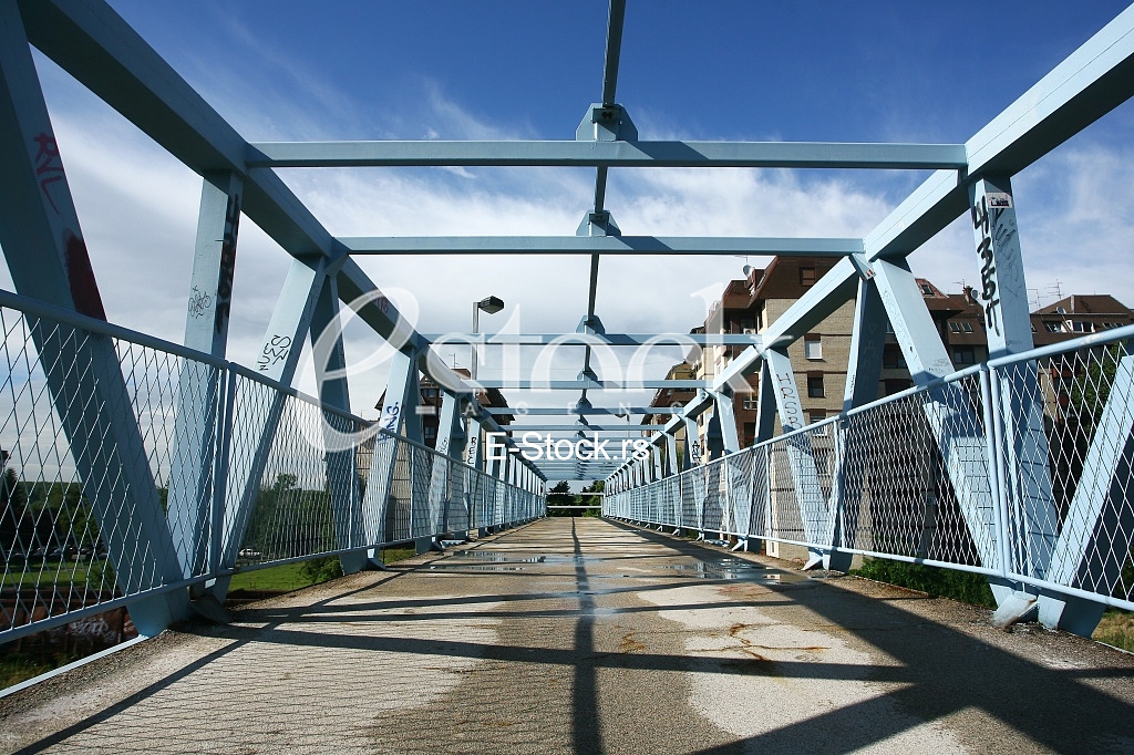 a metal bridge in blue, gangway pedestrian footbridges