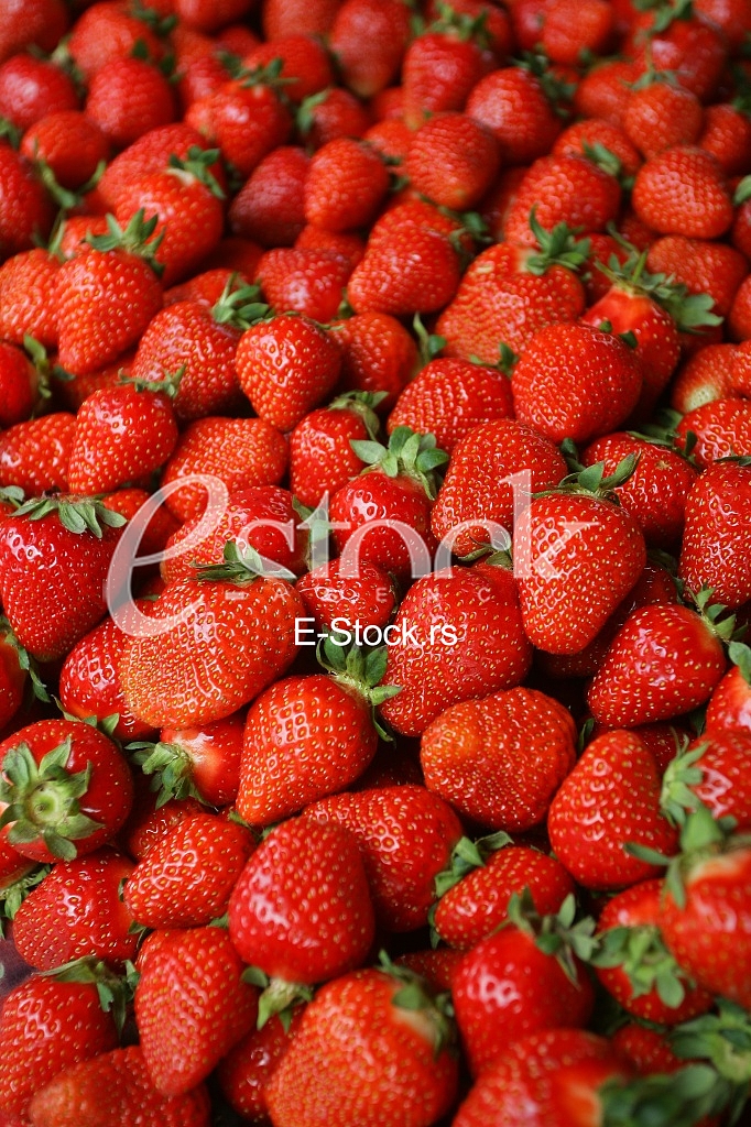 Strawberry fresh natural juicy strawberries to background on the street market
