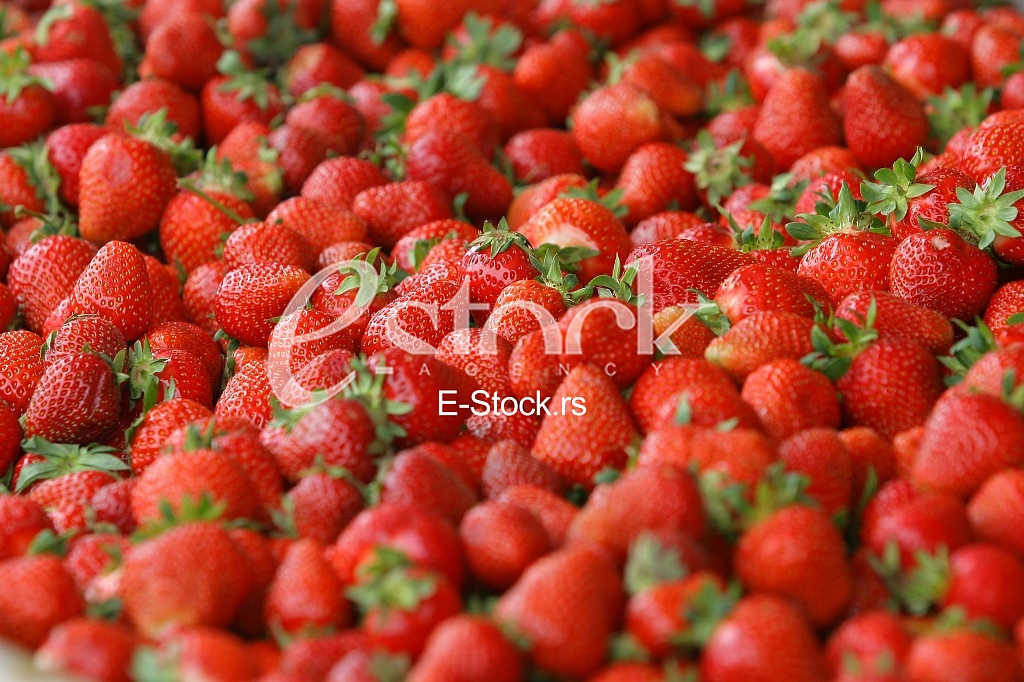 Strawberry fresh natural juicy strawberries to background on the street market
