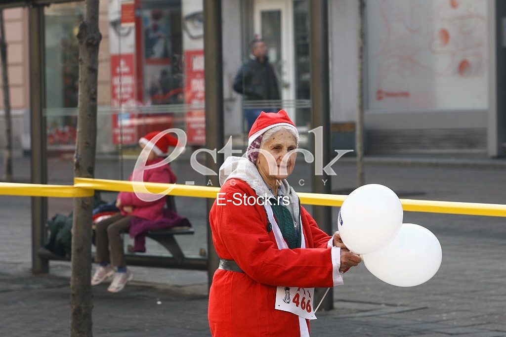 People in Santa Claus costumes take part in the race