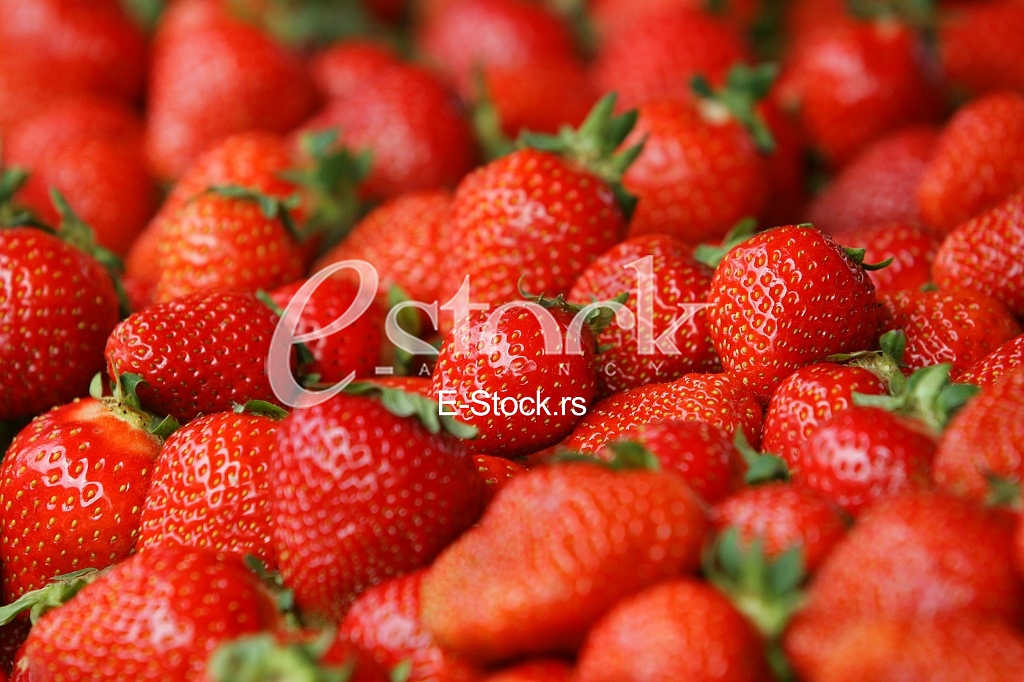 Strawberry fresh natural juicy strawberries to background on the street market
