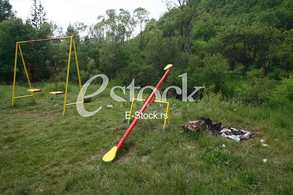 Playground at country side with swings and seesaw