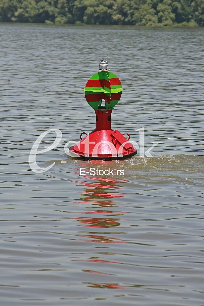 red buoy floating in the river red buoy floating in the river
