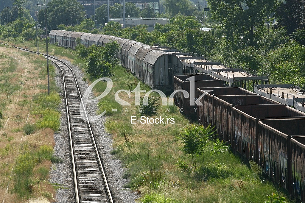 Cargo train platform railway tracks in a rural scene, Empty railway containers for transportation covered with a rust