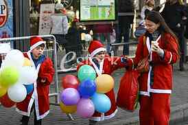 People in Santa Claus costumes take part in the race