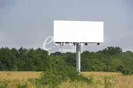 Empty billboard on background of sunset sky