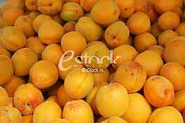 Fresh natural apricot to background on the street market